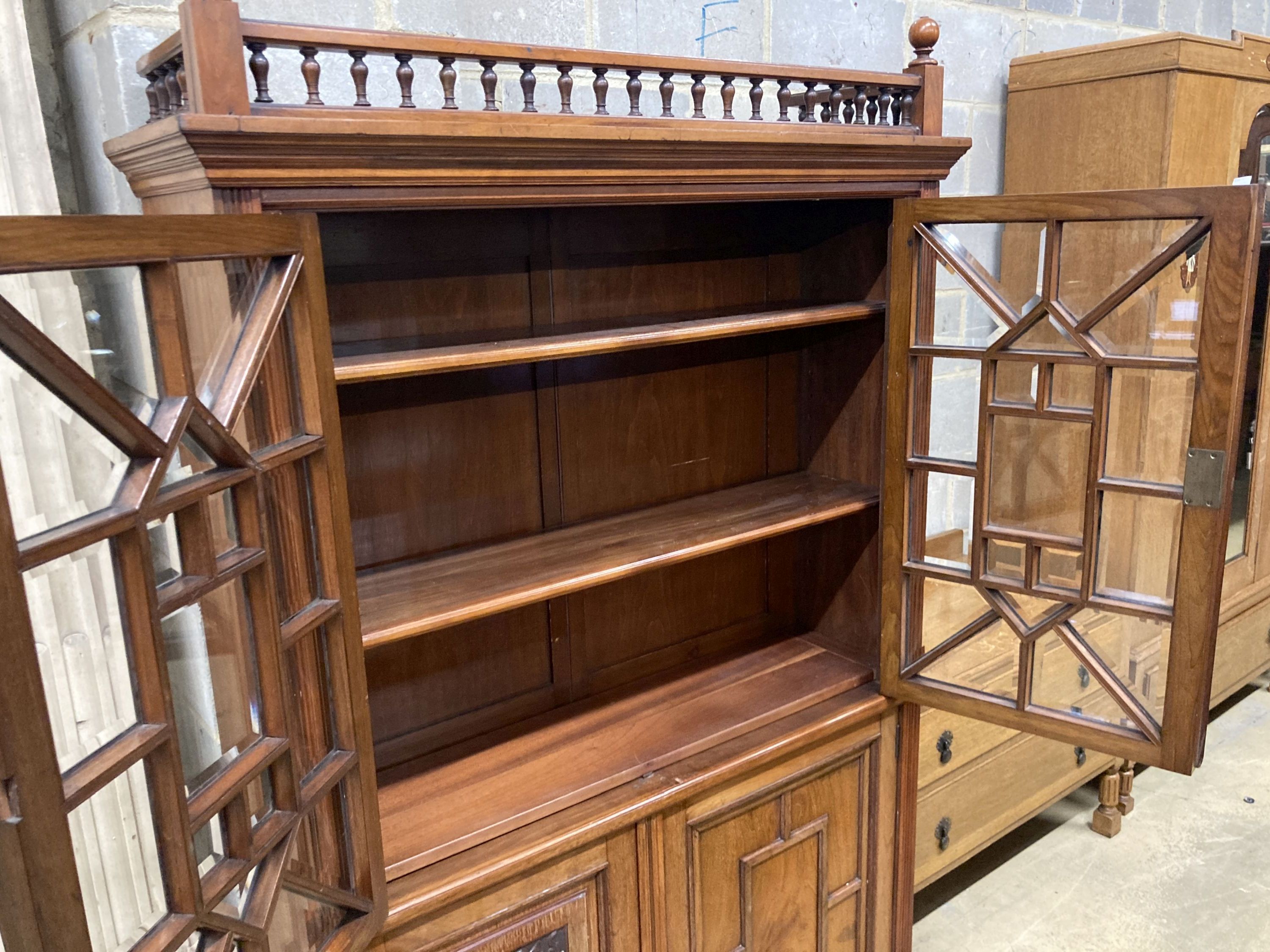 A Victorian walnut glazed bookcase cabinet, width 113cm, depth 33cm, height 184cm